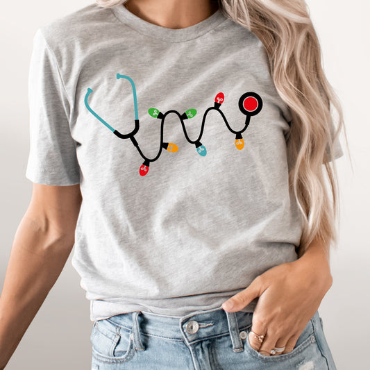 Christmas Stethoscope Graphic Tee | Nurse Doctor Medical Staff | Christmas Lights | Holiday Season | Doctor | Hospital |